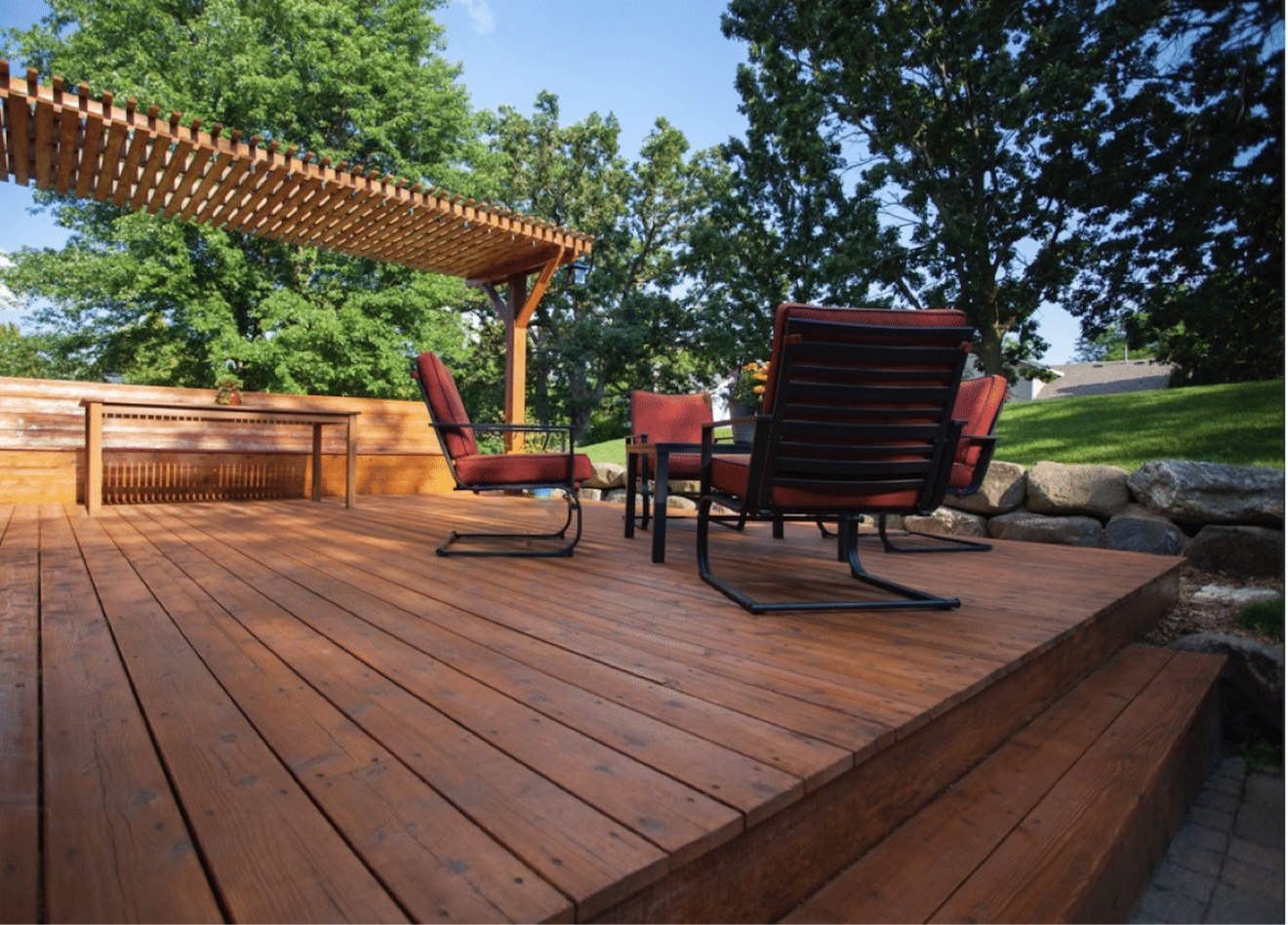 Finished pergola deck with outdoor seating